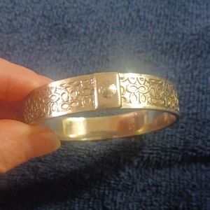 Coach Silver-Tone Engraved Logo Bangle Bracelet